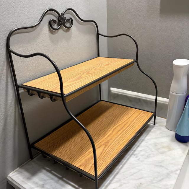 Melamine pantry shelving with two wooden shelves for organized storage in a bathroom setting.
