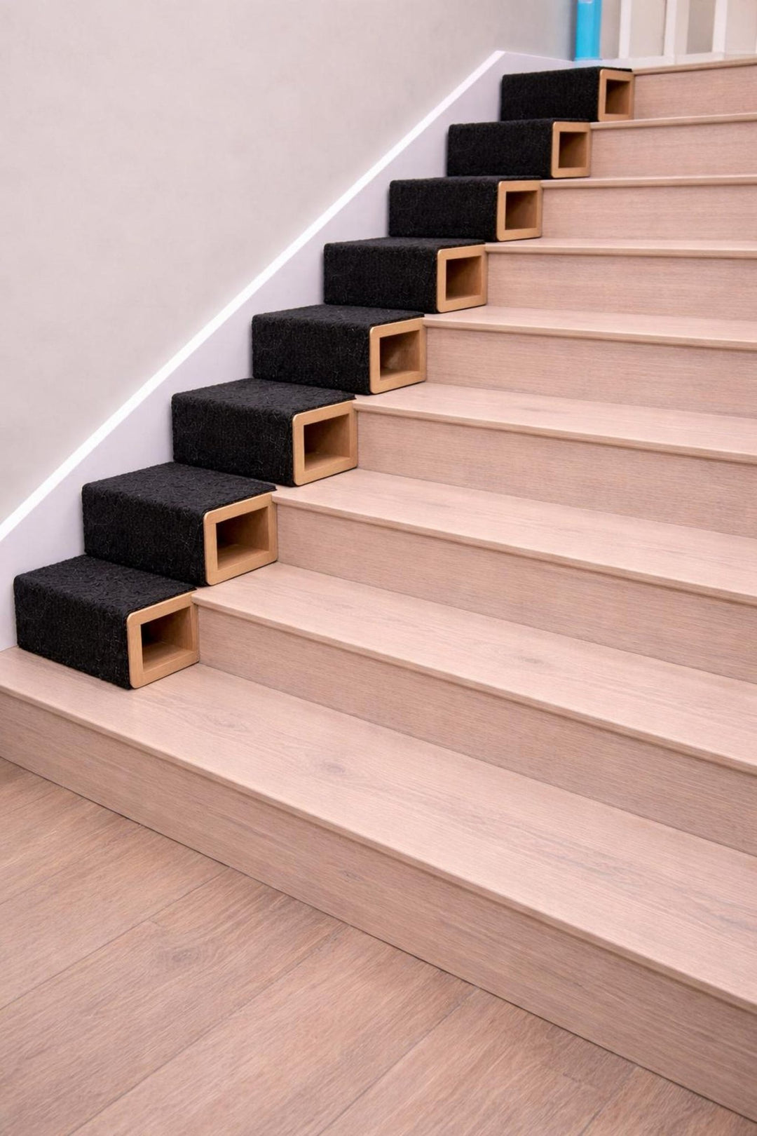 Non-slip dog stairs with carpeted steps designed for stability and safety for pets climbing furniture.