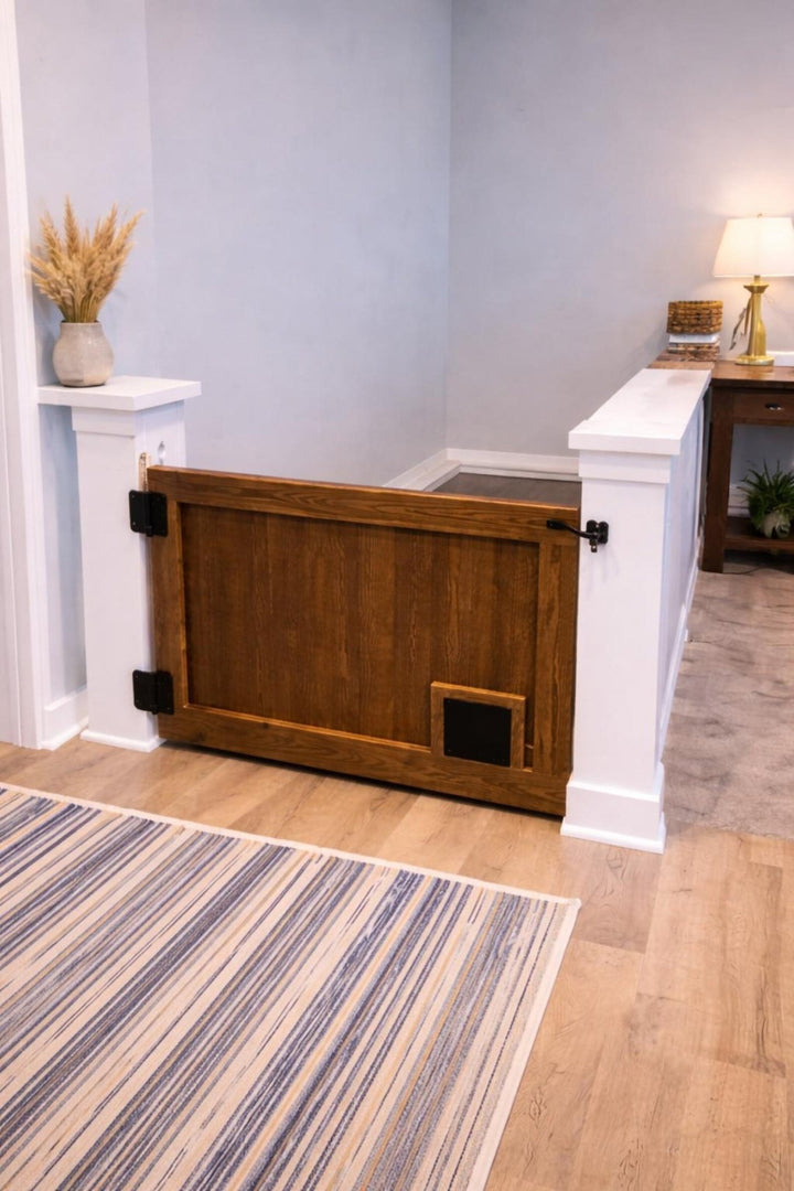 Cat passage gate with pet opening installed in a living room, allowing easy access for pets.