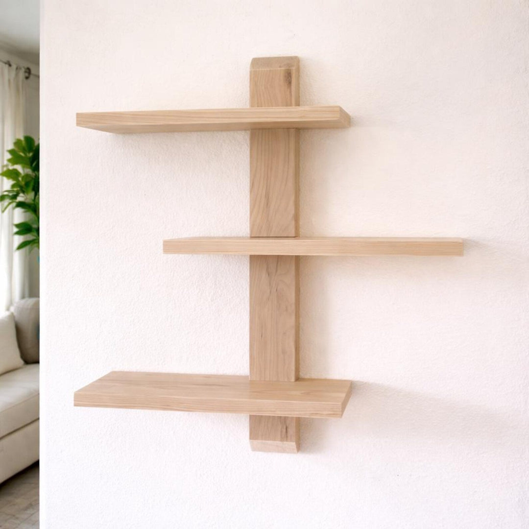Floating wood trinket shelves in light maple finish, mounted on a wall, showcasing elegant storage solution.