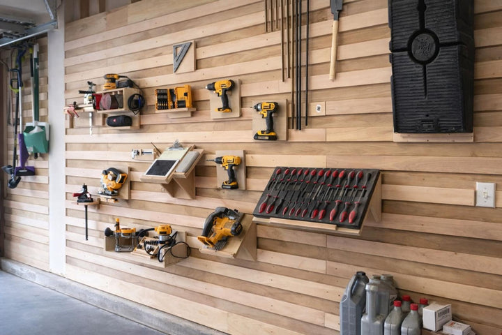 Custom wood french cleat shelf system showcasing tools and storage in a garage wall setup.