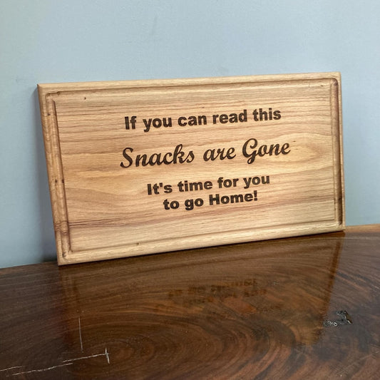 Christmas serving tray engraved with humorous text about snacks being gone.