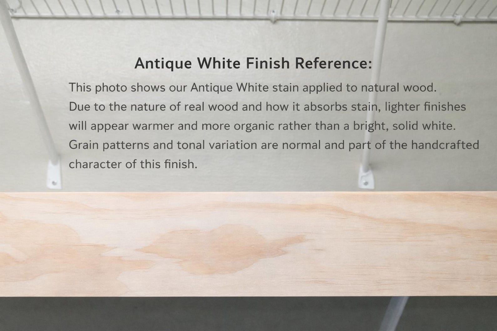 modern sliding slat baby gate reference showing natural wood stain characteristics and variations in grain pattern.