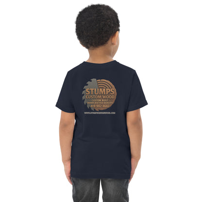 Boy wearing Stumps Custom Wood Toddler jersey t-shirt with logo on back, perfect for comfort and adventure.