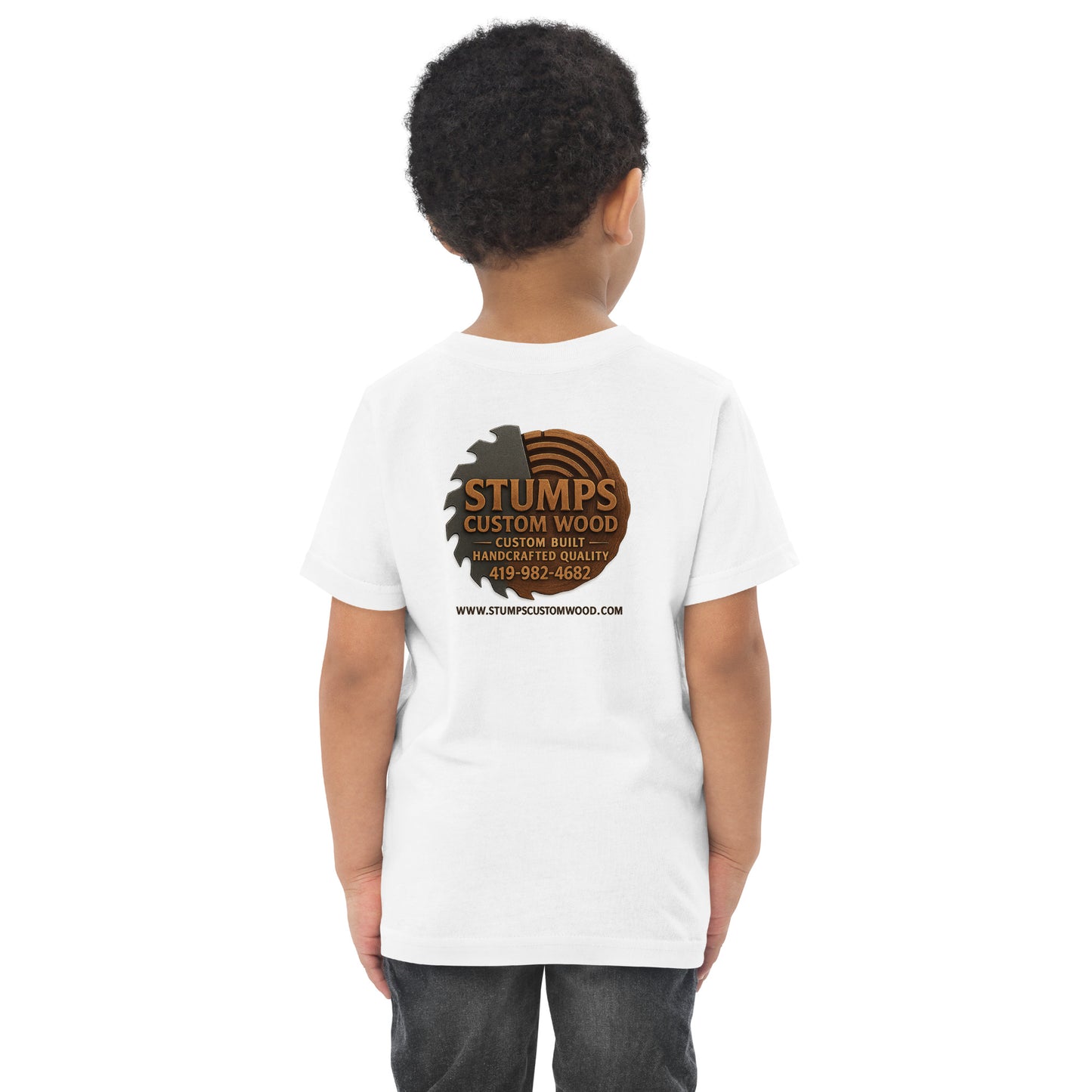 Child wearing Stumps Custom Wood Toddler jersey t-shirt showcasing the brand logo on the back.