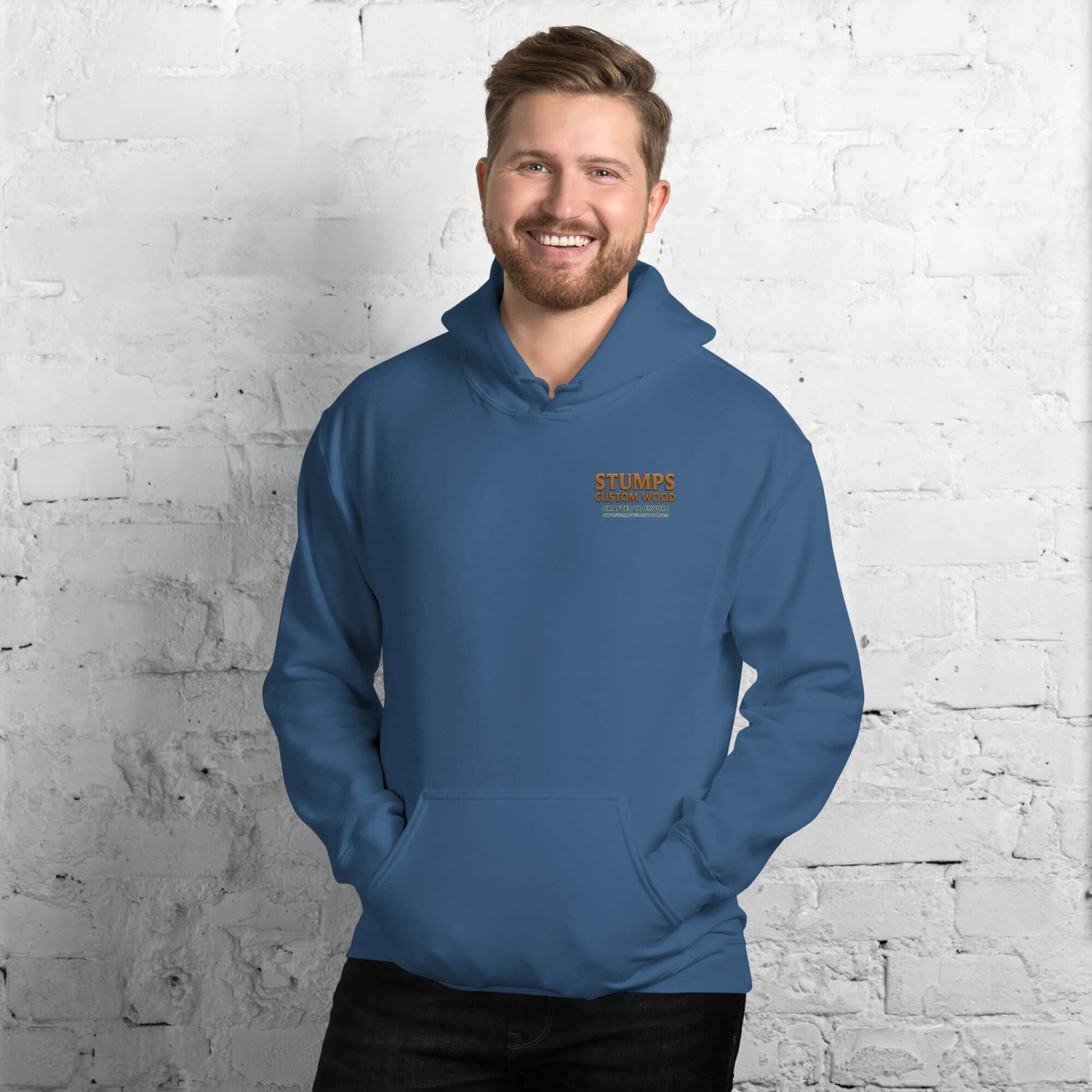 Man wearing a Stumps Custom Wood Unisex Hoodie in blue, showcasing its cozy and stylish design.