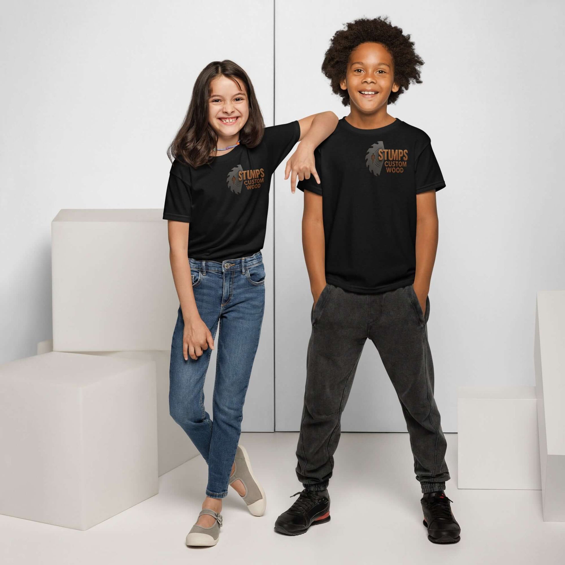 Stumps Custom Wood Youth t-shirt worn by two kids, showcasing a modern fit and moisture-wicking fabric.