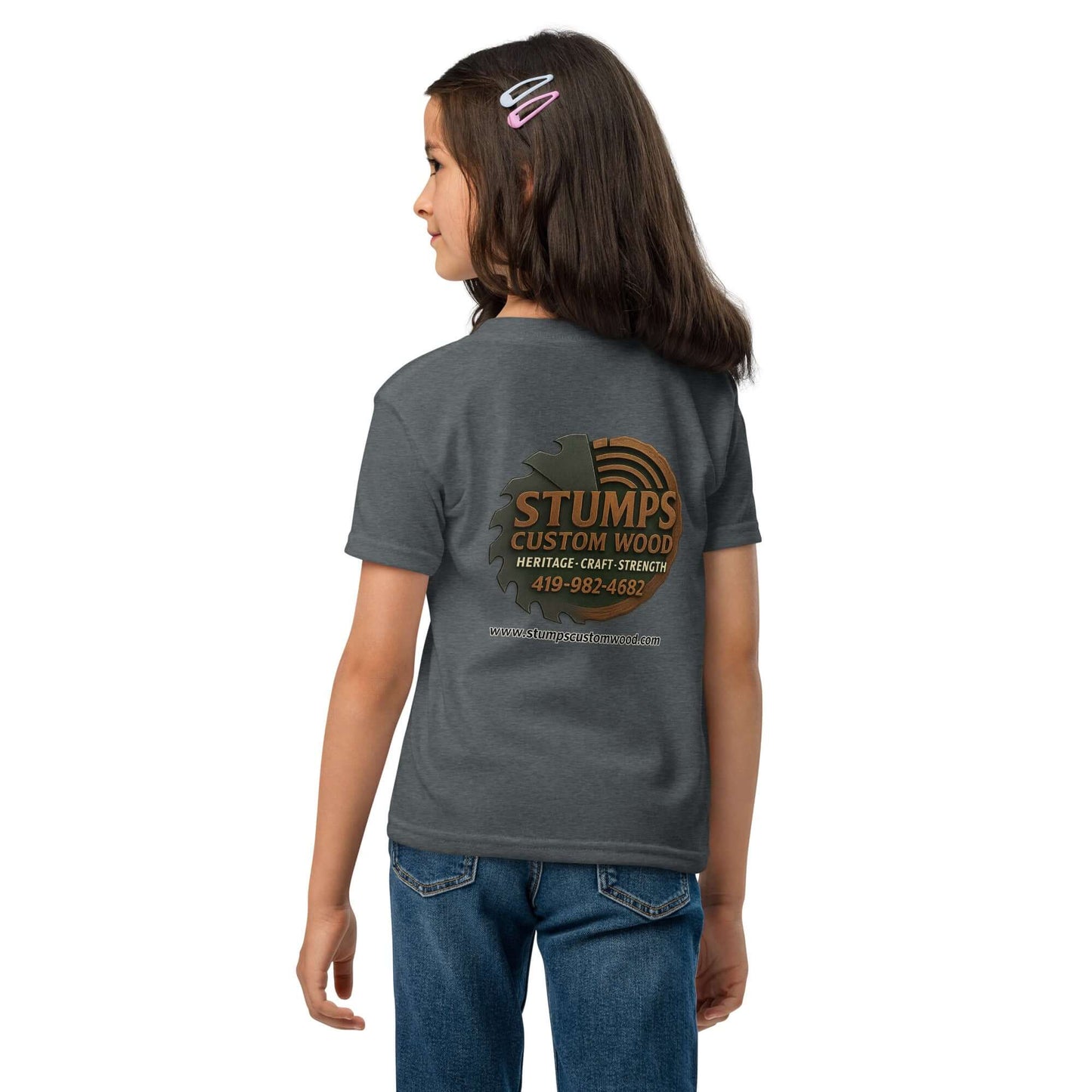 Girl wearing Stumps Custom Wood Youth t-shirt showcasing the brand's logo on the back in grey fabric.